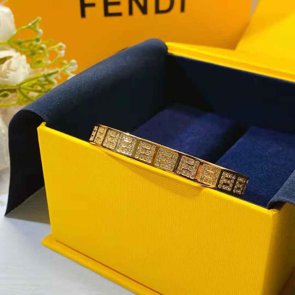 Top-down shot highlighting the signature FF logo on Fendi Women Stiff Narrow-Band FF Bracelet Gold-colored