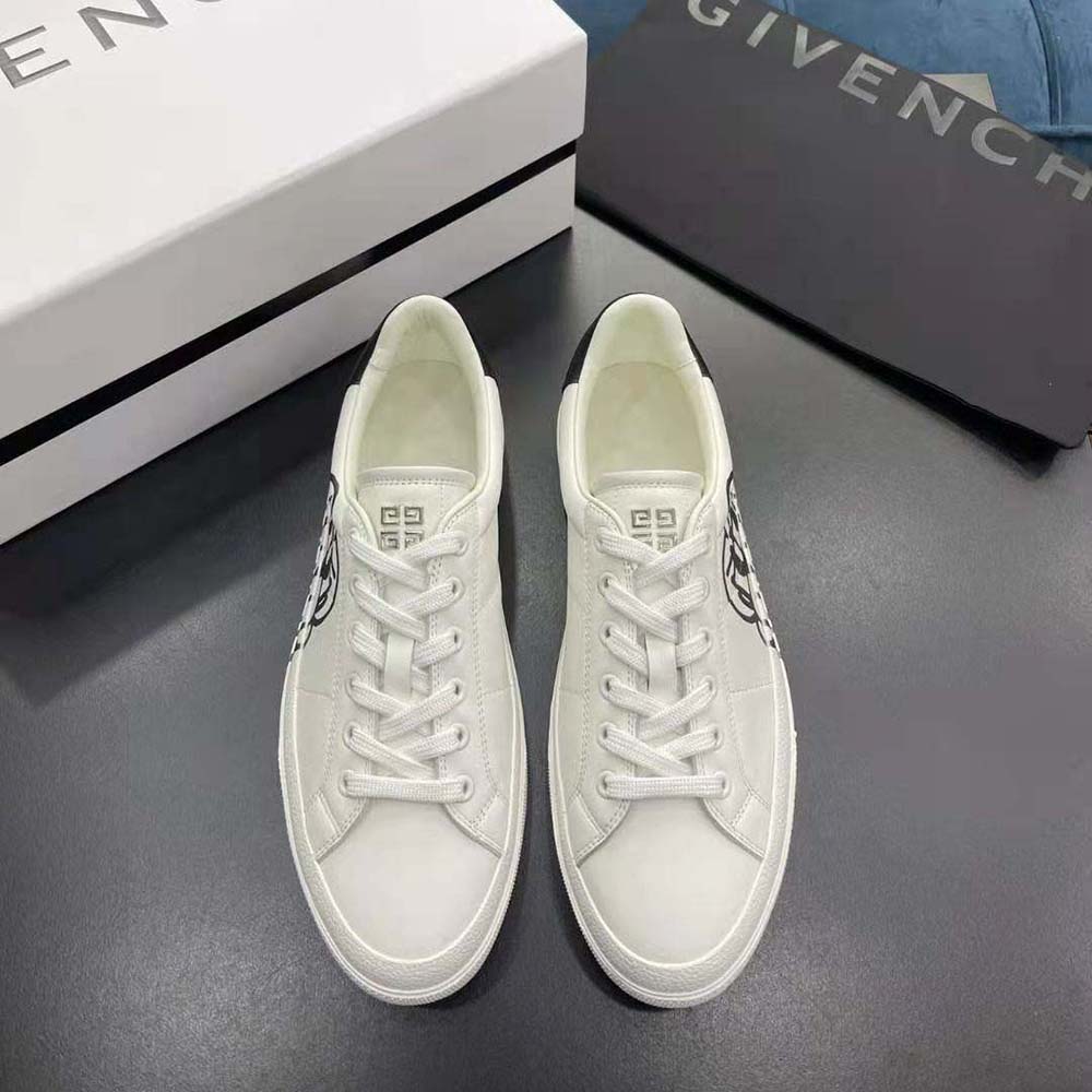 Close-up of tag effect dog print detail on Givenchy white sneakers