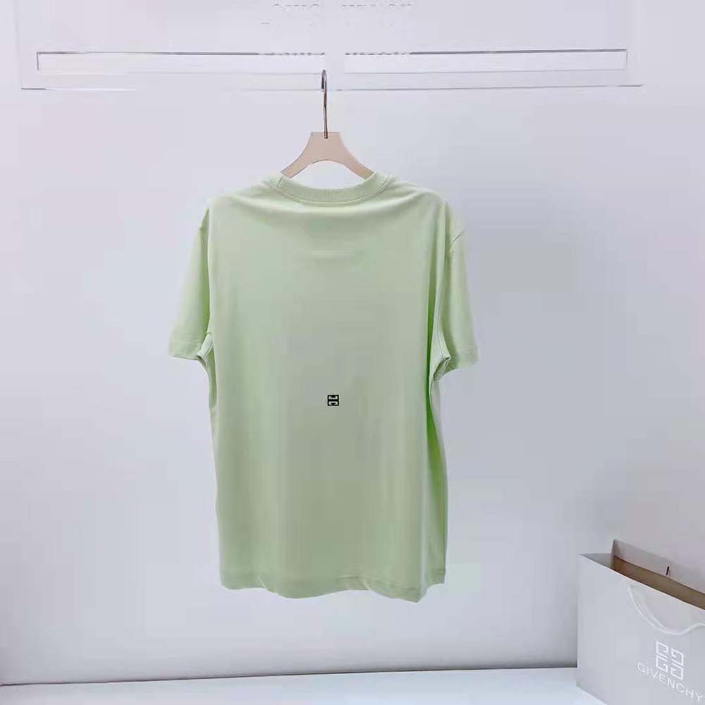 Side angle showing slim fit silhouette of Givenchy Reaper patch T-shirt