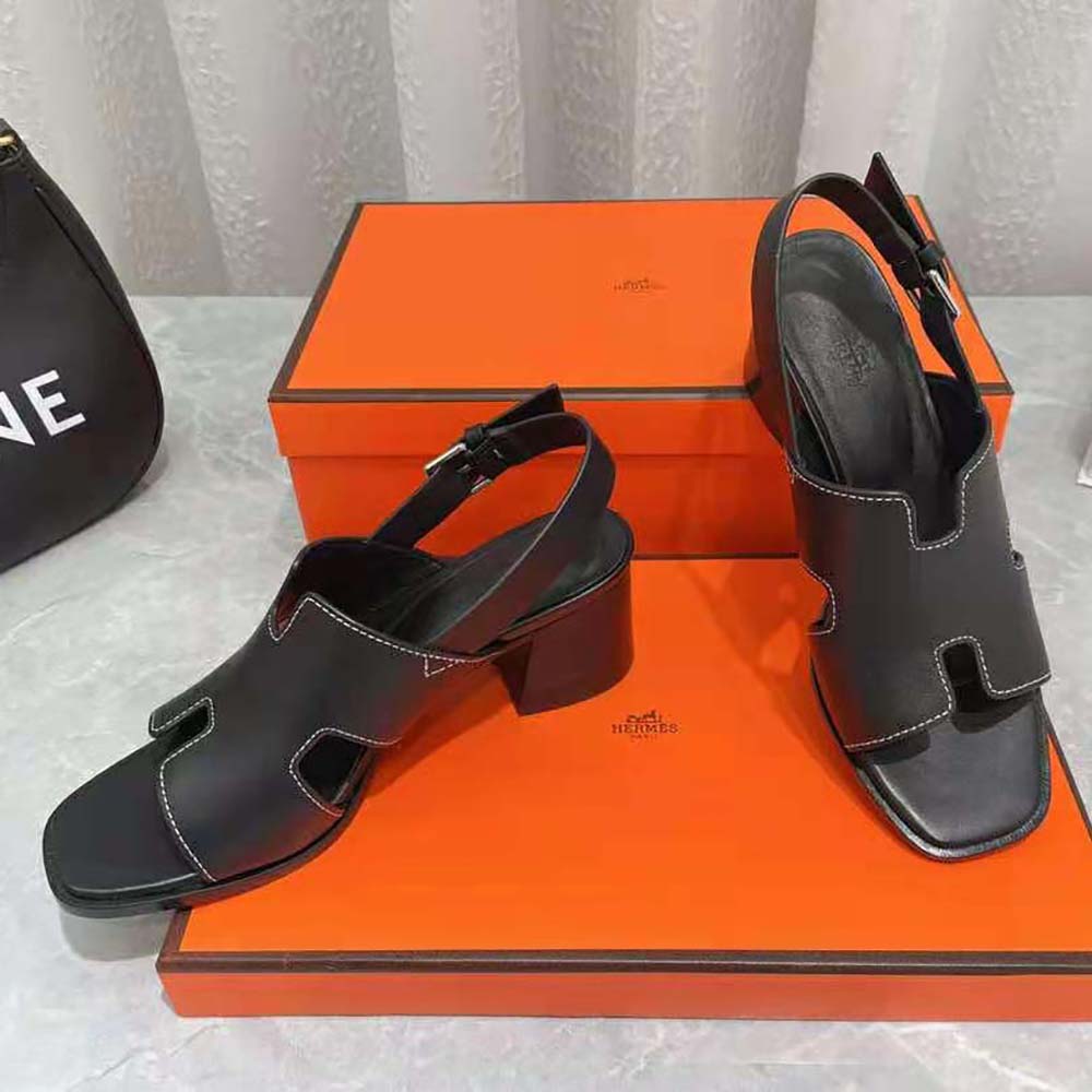 Top view showcasing elegant silhouette of Hermes Elbe 60 Sandal black