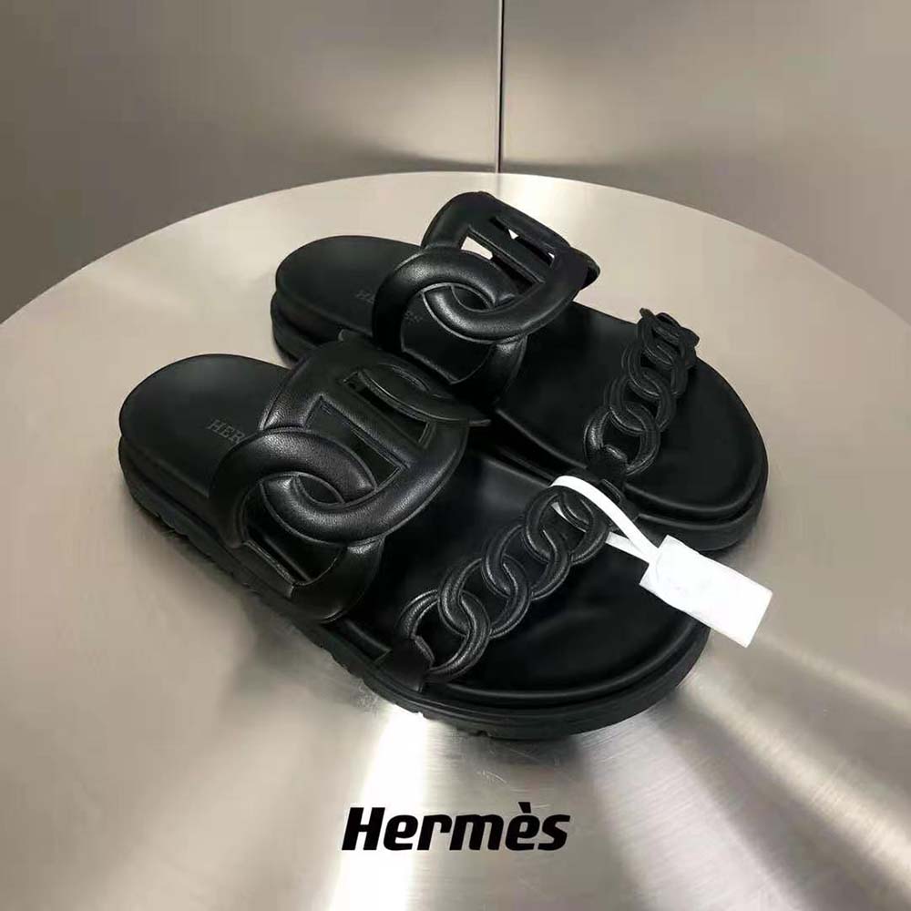 Close-up detail of embossed hardware on Hermes Women Extra Sandal in Nappa Leather-Black