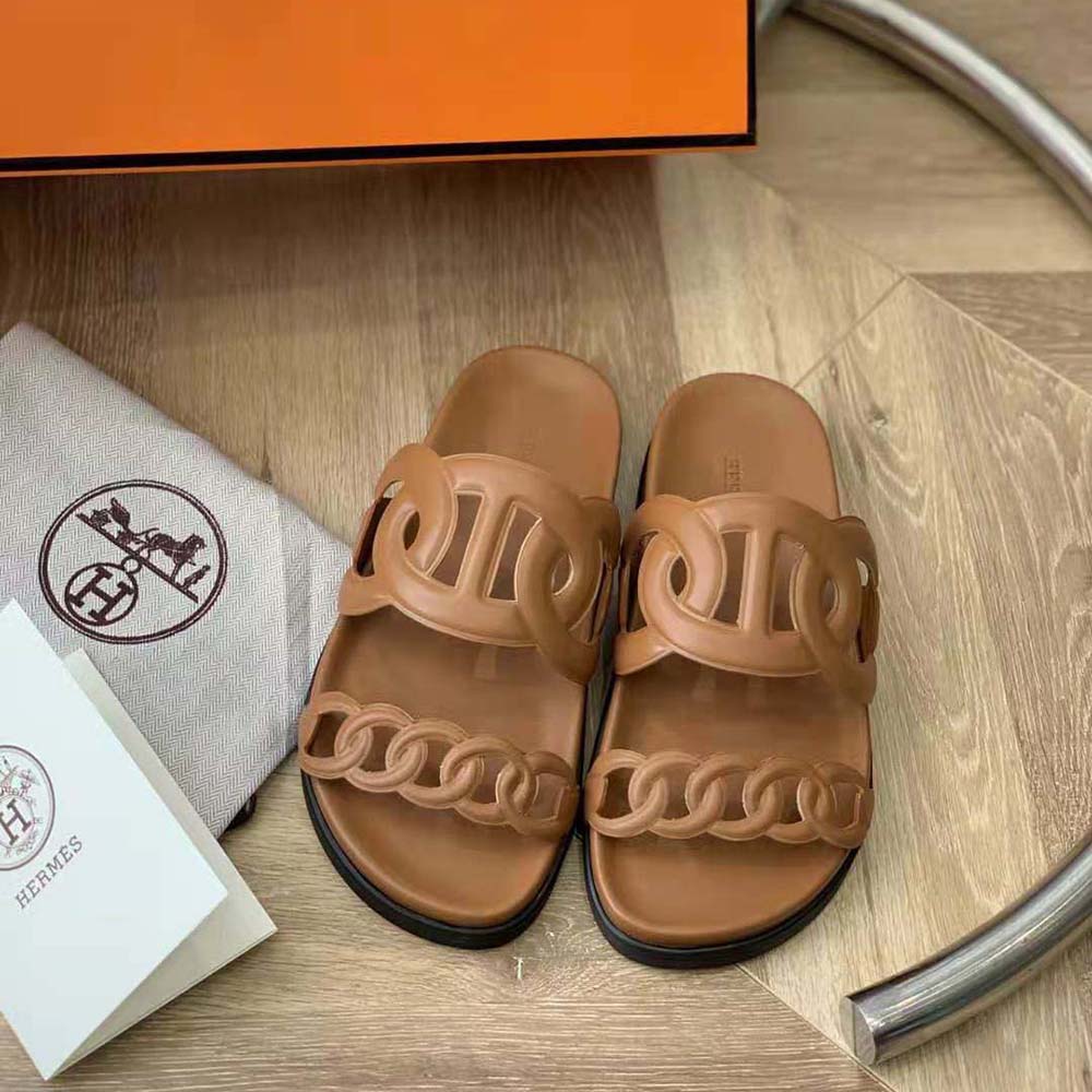 Close-up of adjustable closure and Hermes hardware detail on sandal