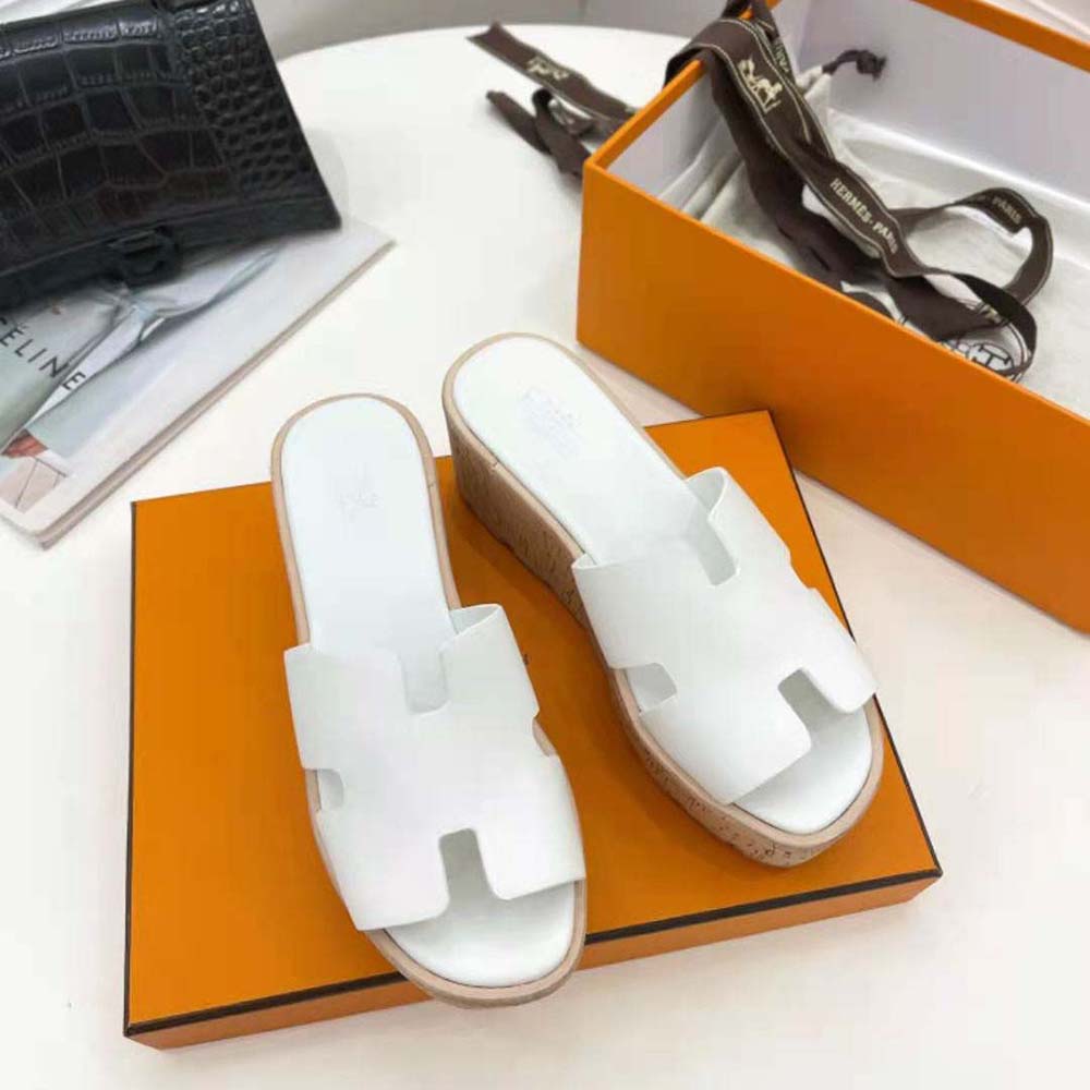 Top angle showing white leather strap and buckle on Hermes Women Eze 30 Sandal