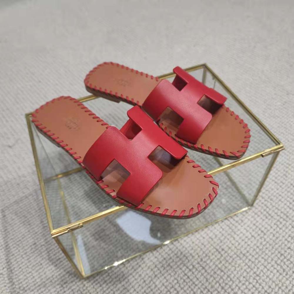 Close-up detail of red braided calfskin and H cut-out sandal