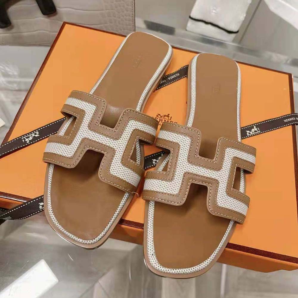 Close-up on iconic H cut-out detail on Hermes Women Oran Sandal