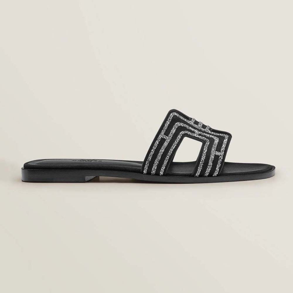 Side view of Hermes Women Oran Sandal in Suede Goatskin-Black