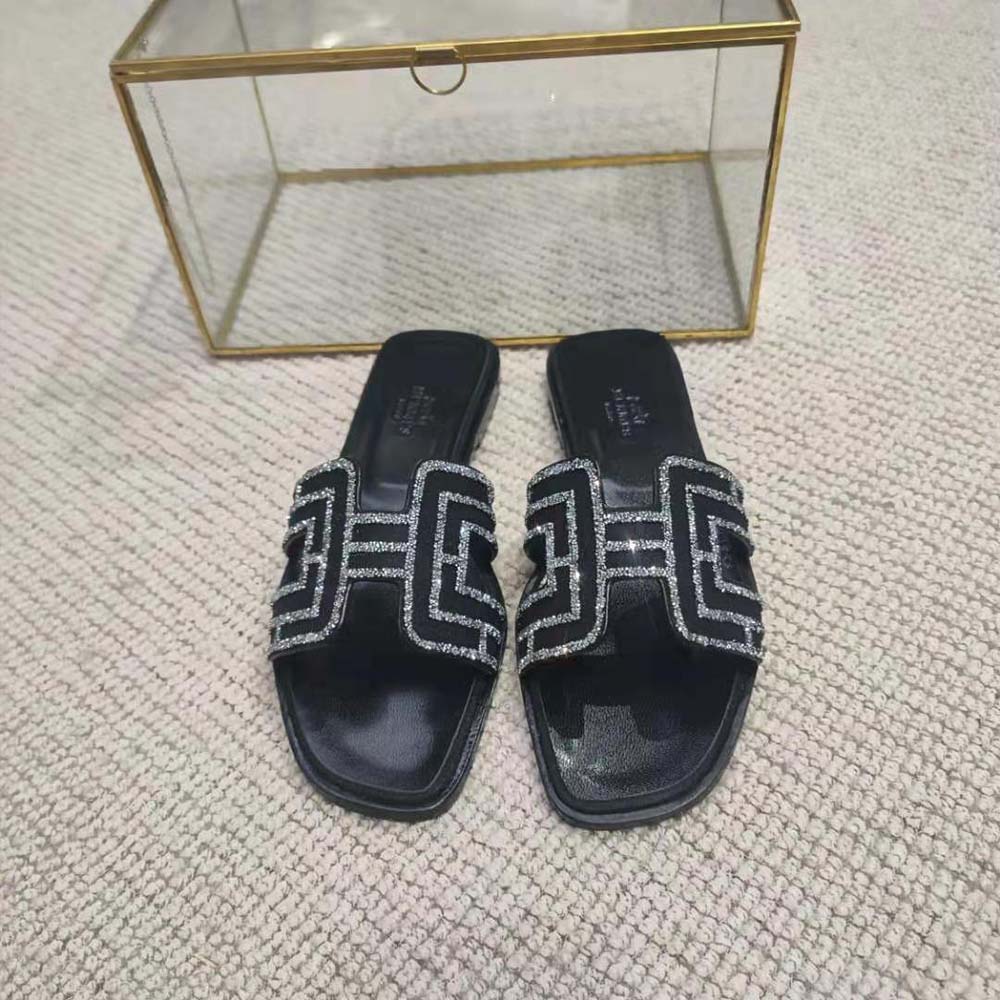 Close-up of signature 'H' cut-out on Hermes Women Oran Sandal