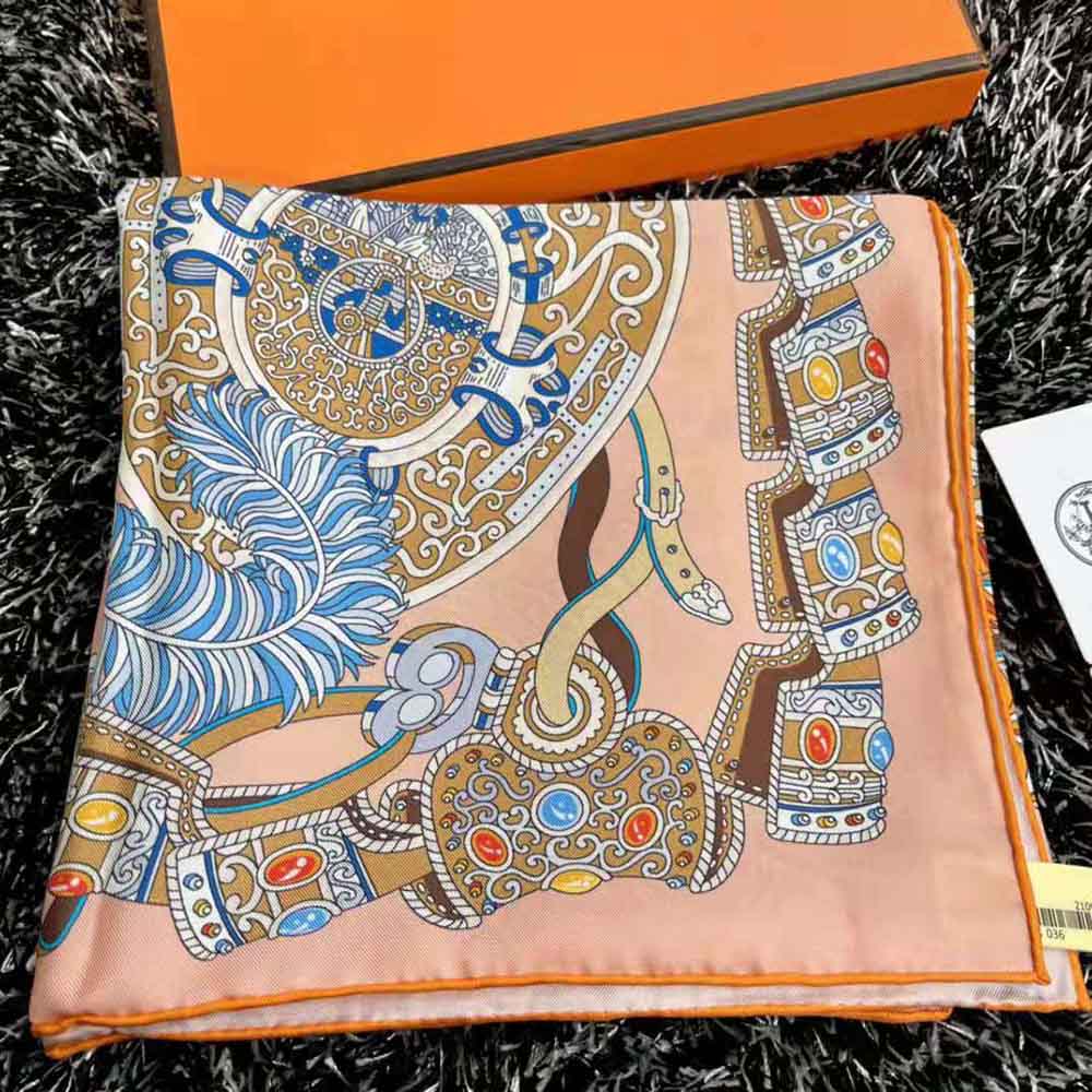 Close-up detail of Hermes Women Sous L Egide De Mars Wash Scarf 90-Orange silk texture