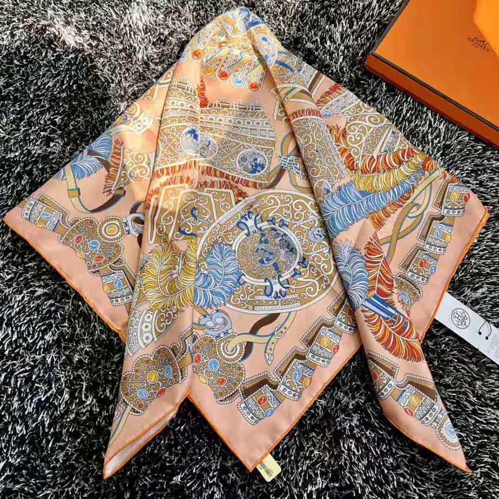 Model wearing Hermes Women Sous L Egide De Mars Wash Scarf 90-Orange styled as neck wrap