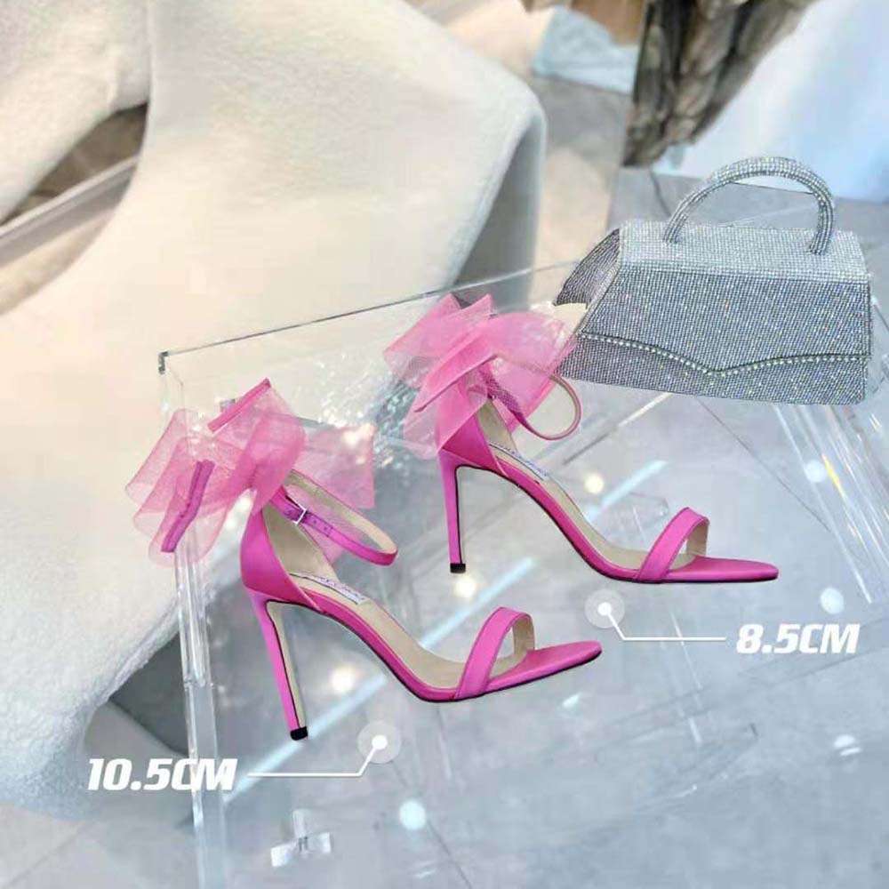 Close-up detail of asymmetric grosgrain mesh fascinator bows on sandals