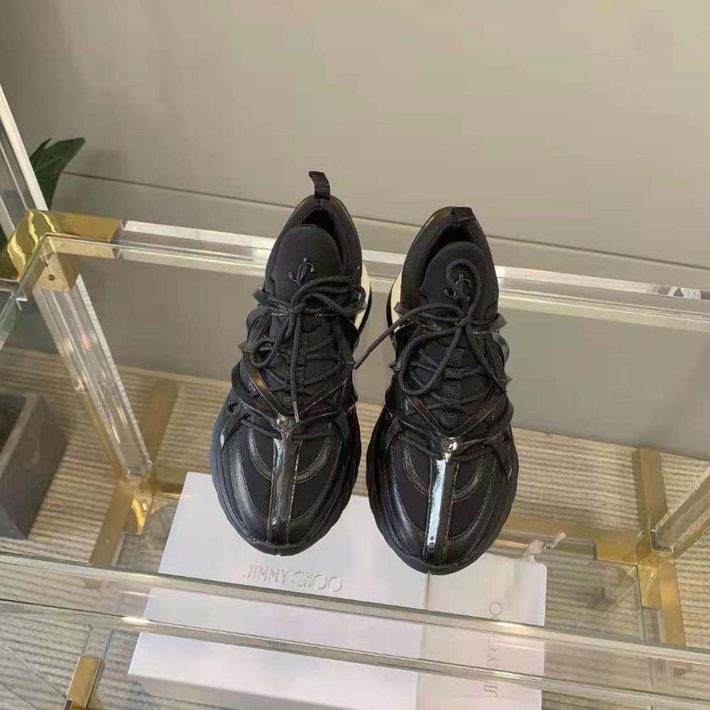 Close-up of black leather and neoprene detailing on Jimmy Choo Cosmos/F trainers
