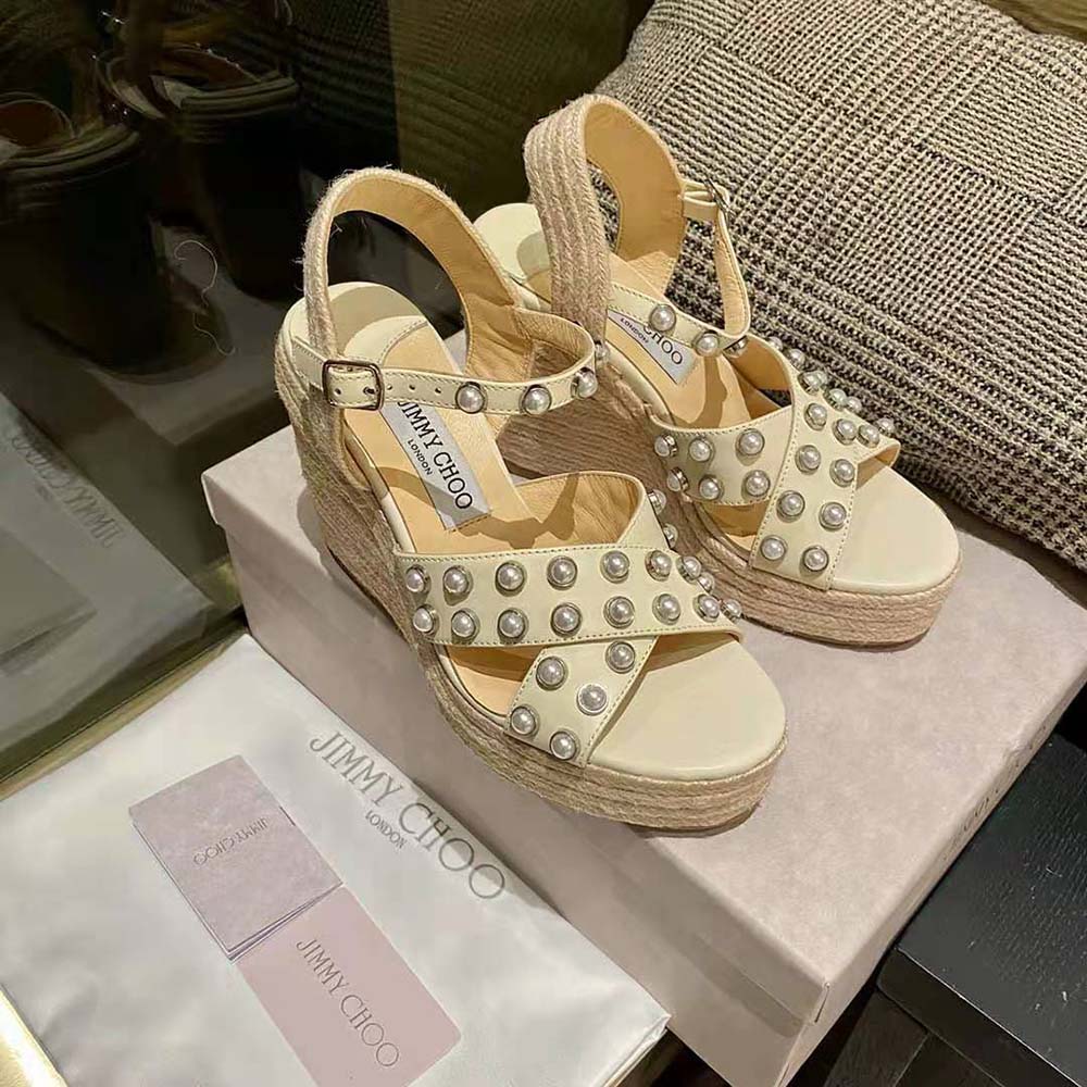 Side profile showing wedge heel of Jimmy Choo Women Dellena 100 Latte Nappa Wedges