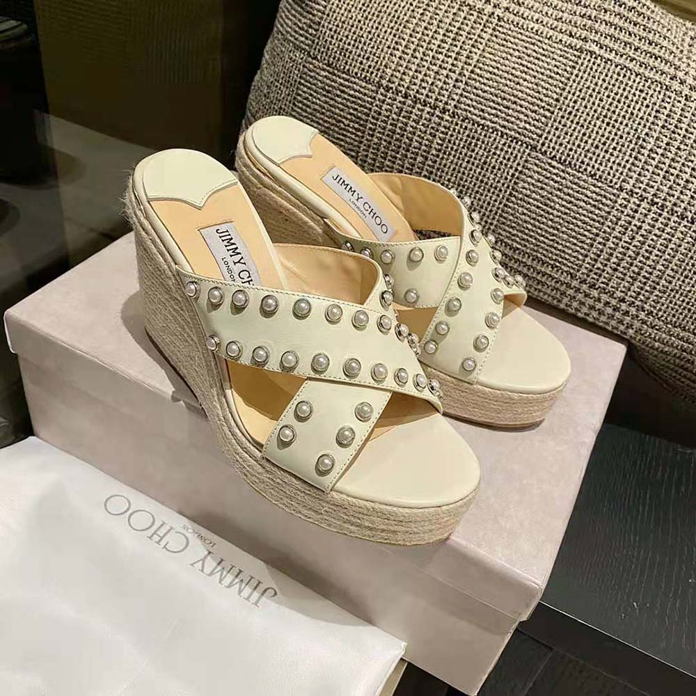 Top angle showing slip-on design and white nappa leather on Jimmy Choo wedges