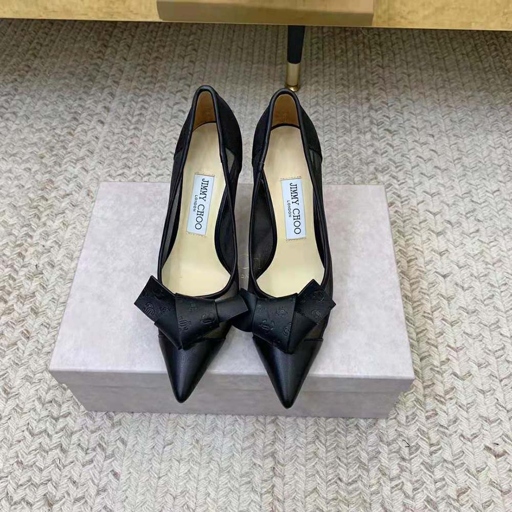 Close-up on JC monogram leather bow detail on Lani 100 pumps