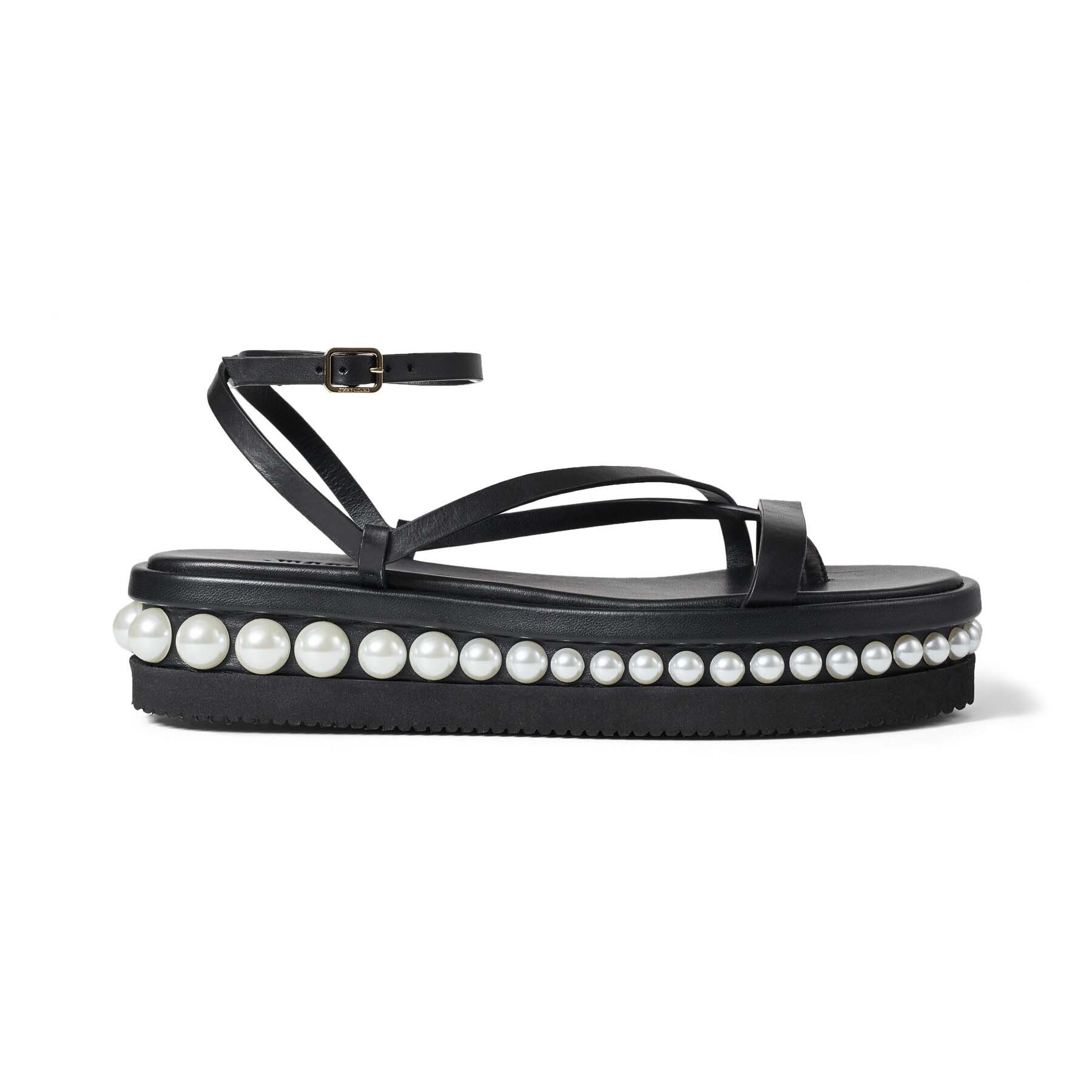 Side view of Jimmy Choo Women Pine Flat Black Vachetta Leather Platform Sandals