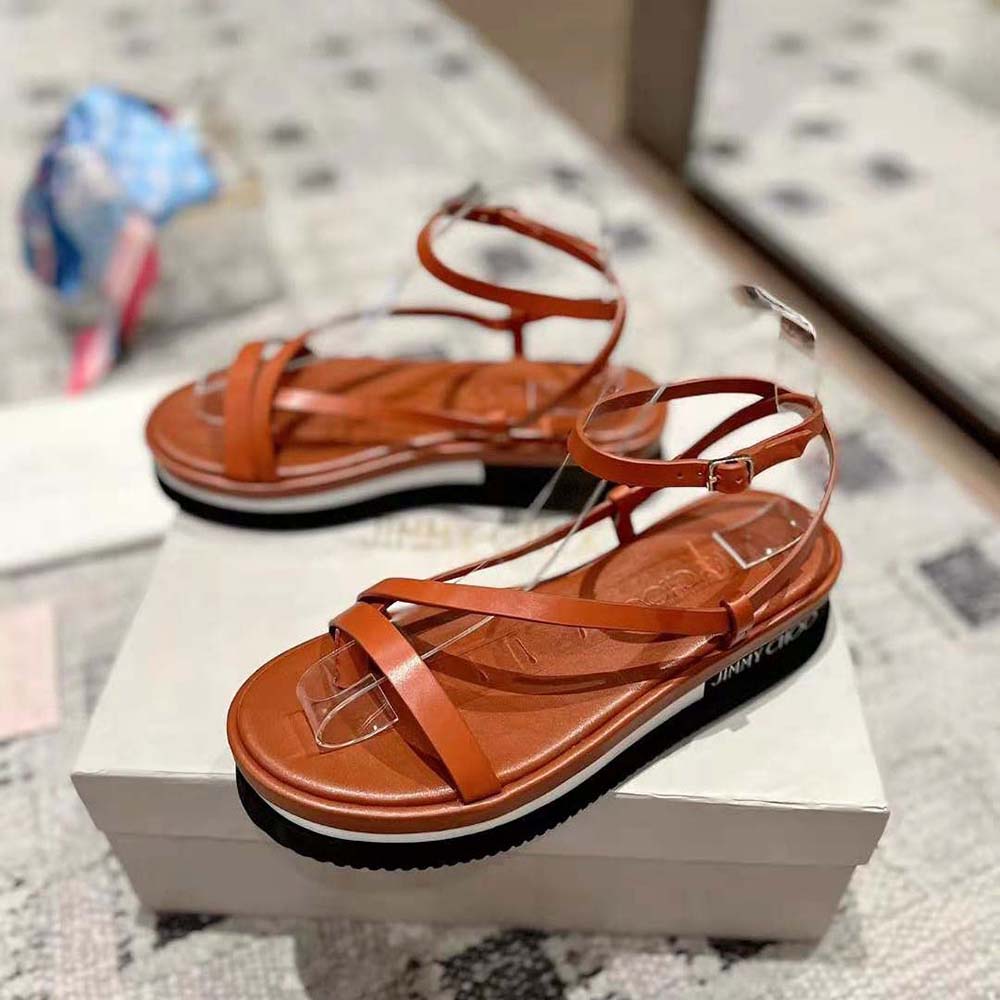 Top view showing brown leather and platform of Jimmy Choo Pine Flat Sandals