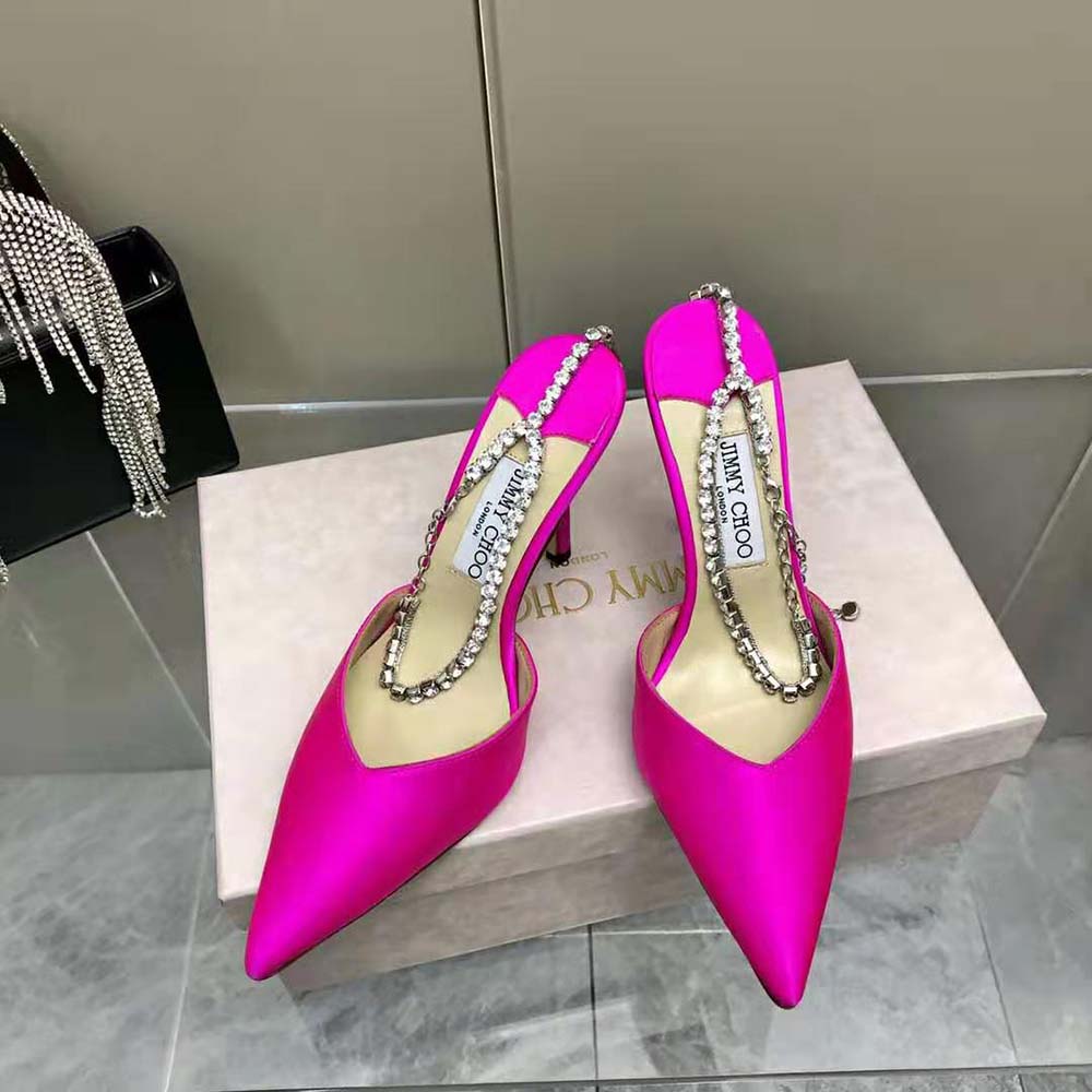 Close-up of crystal embellishment on Jimmy Choo Saeda 100 satin pumps