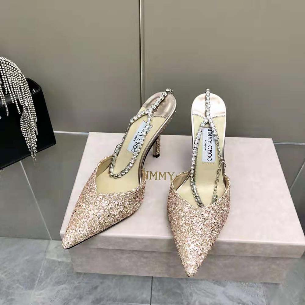 Close-up detail of rose coarse glitter fabric on Jimmy Choo Saeda pumps