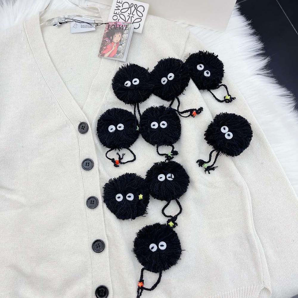 Side profile showing silhouette of Loewe Women Susuwatari Wool Cardigan in White