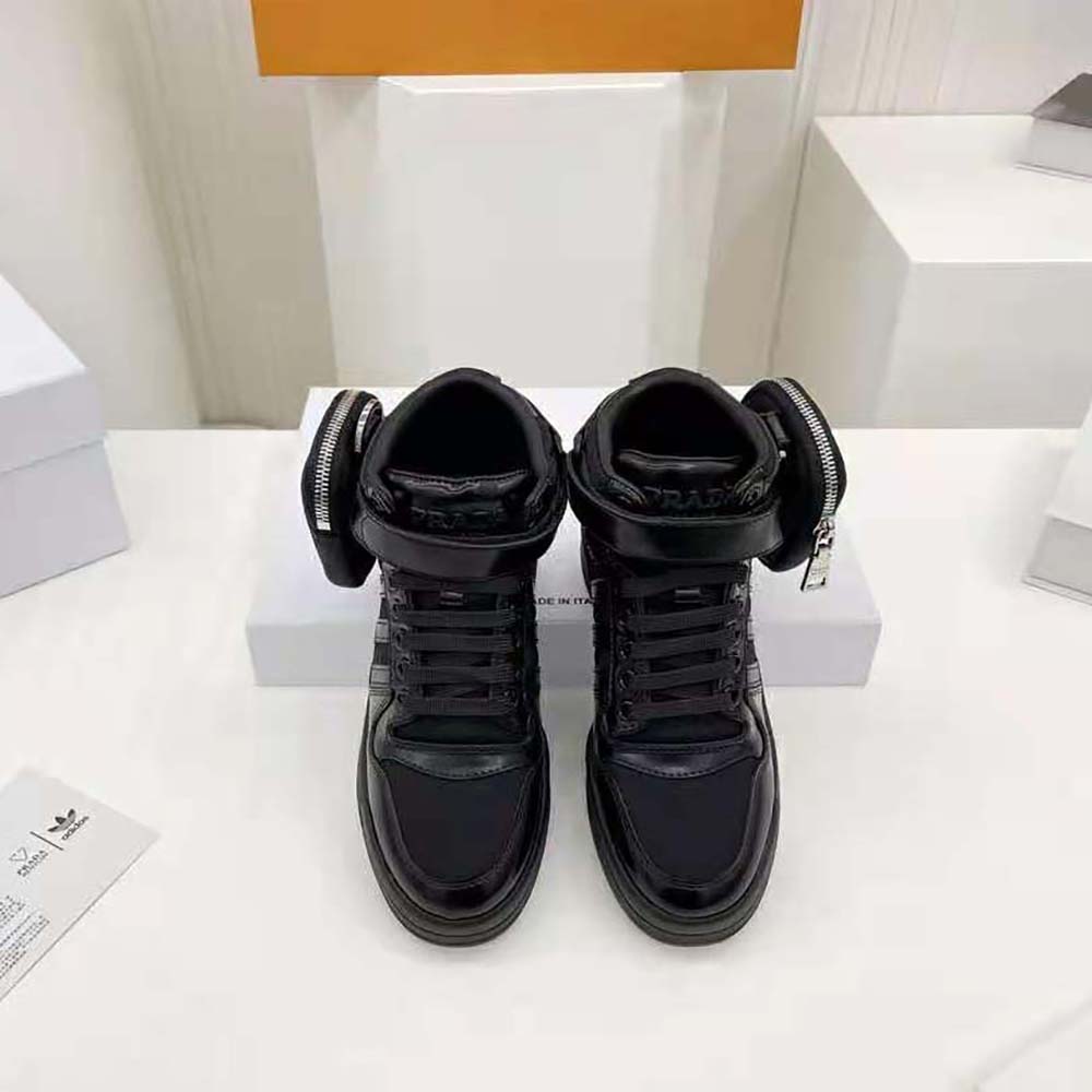 Close-up on laces and metal eyelets on Prada Women Adidas for Prada Re-Nylon sneakers