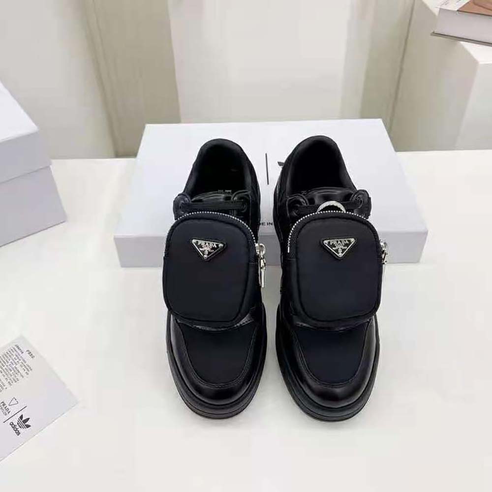 Close-up of black Re-Nylon fabric and Prada logo hardware detail