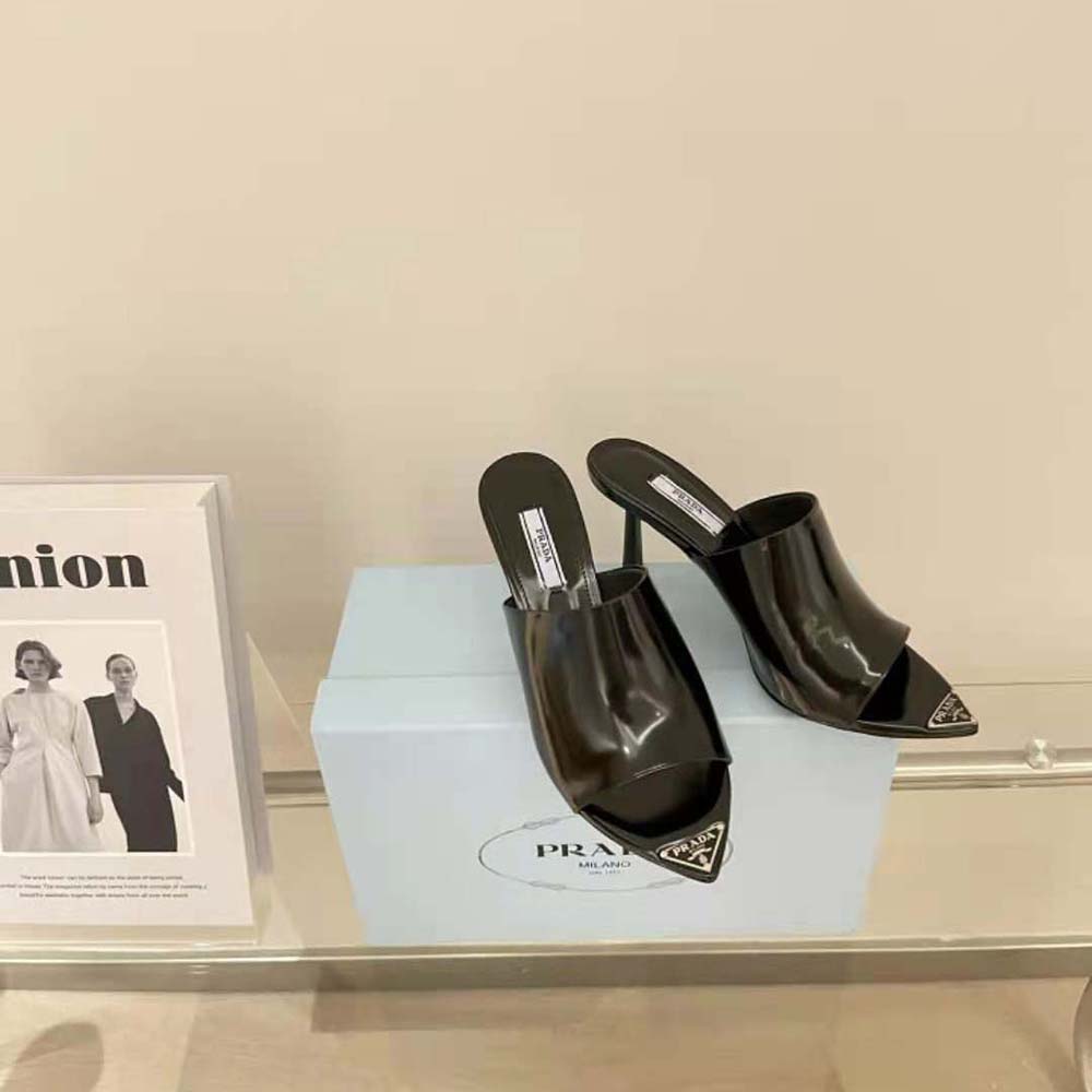 Top-down view showing open-toe and slip-on design of Prada slides