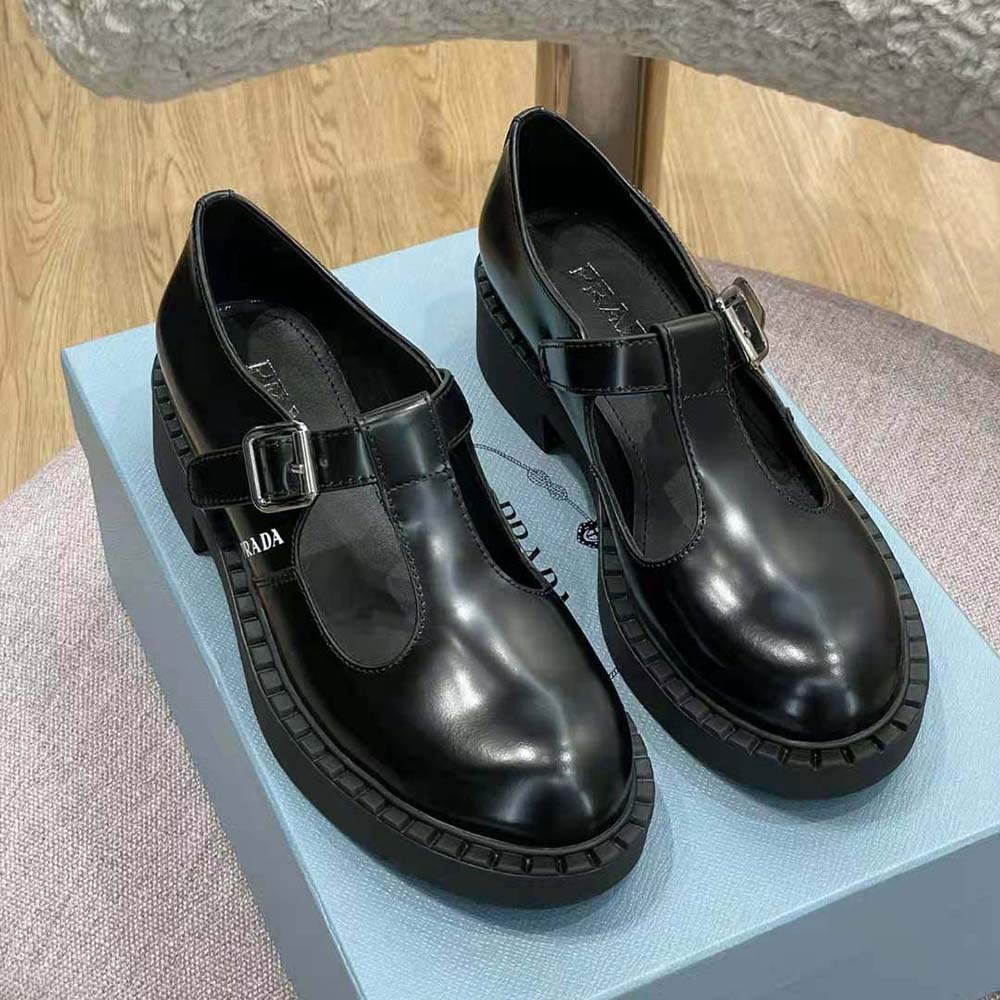 Top-down angle of Prada Women Brushed leather T-Strap Shoes-Black detailing straps