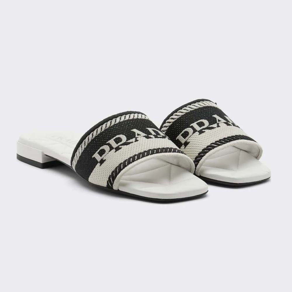 Side view of Prada Women Embroidered Fabric Slides With Embroidered Lettering Logo-White