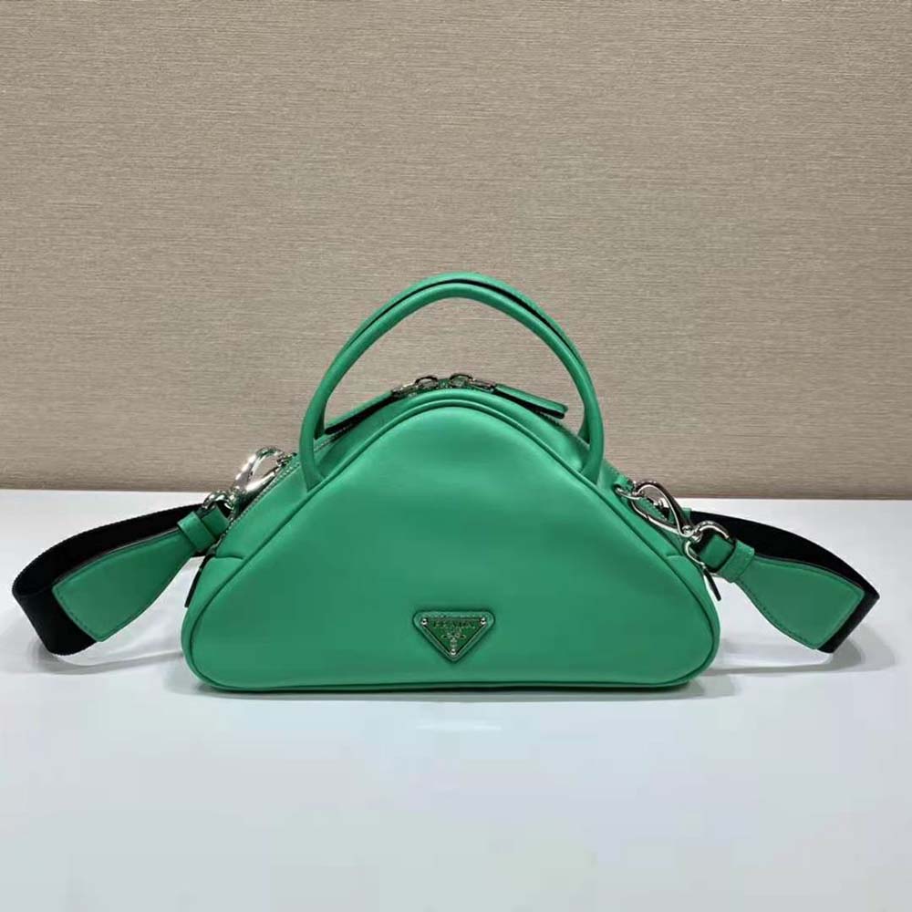 Side angle highlighting zip closure and compact size of Prada Triangle Bag-Green