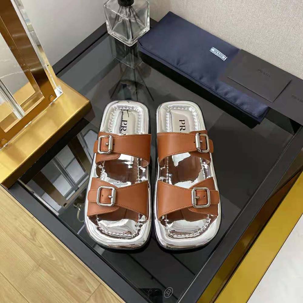 Close-up of metal buckle detail on Prada Women Leather Sandals in brown