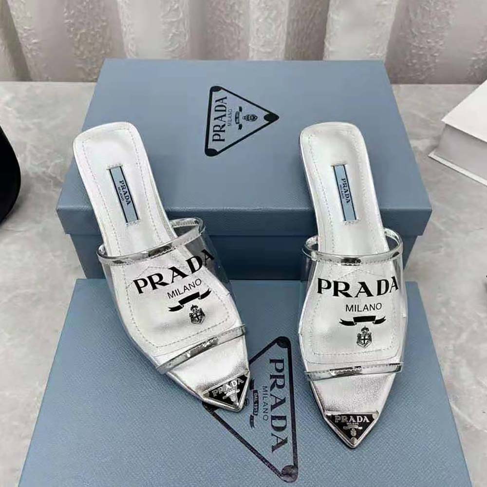 Top-down view highlighting flat sole and slip-on style of Prada Women Logo-Print Plexiglas Slides-Silver