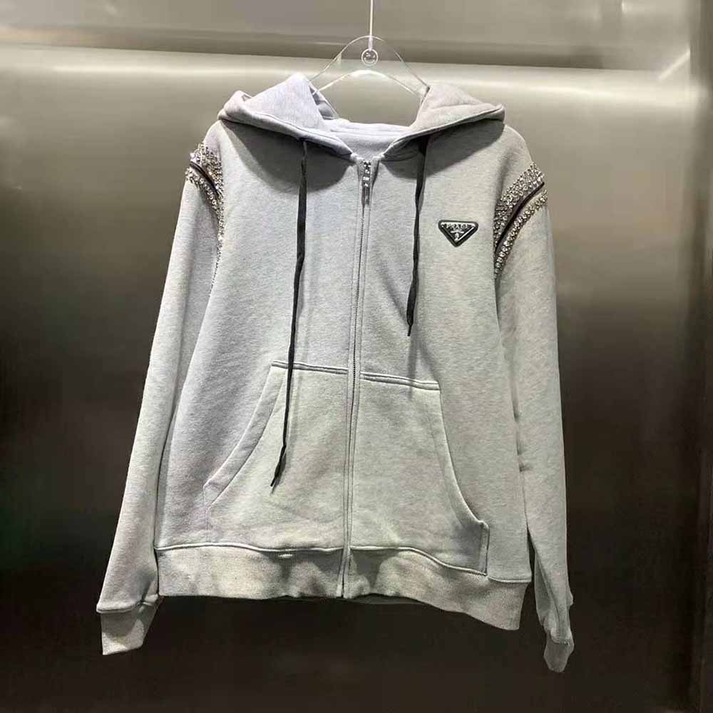 Close-up of studded hardware detail on the Prada Women Oversized Studded Hoodie-Silver