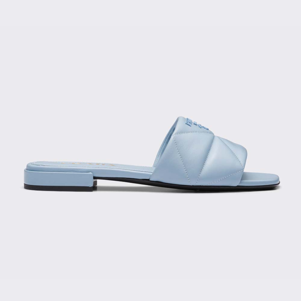 Side profile of Prada Women Quilted Nappa Leather Sabots-Blue showing quilted detail