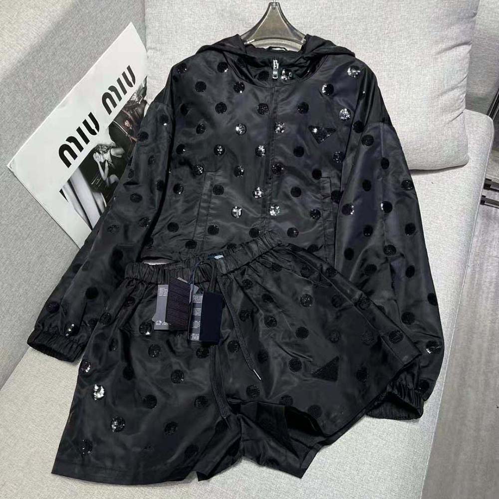 Close-up of embroidered detail on Prada Women Re-Nylon Embroidered Jacket-Black sleeve