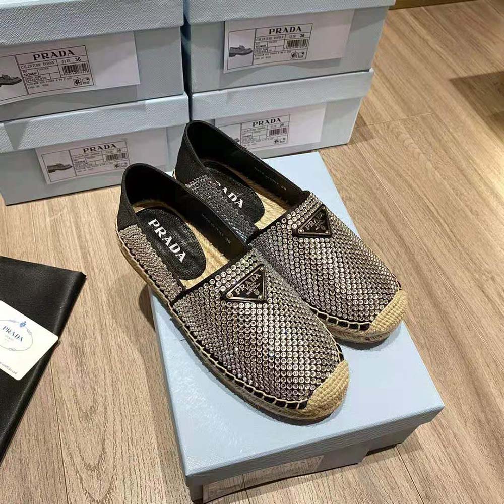 Side profile showing jute sole and satin upper of Prada espadrilles