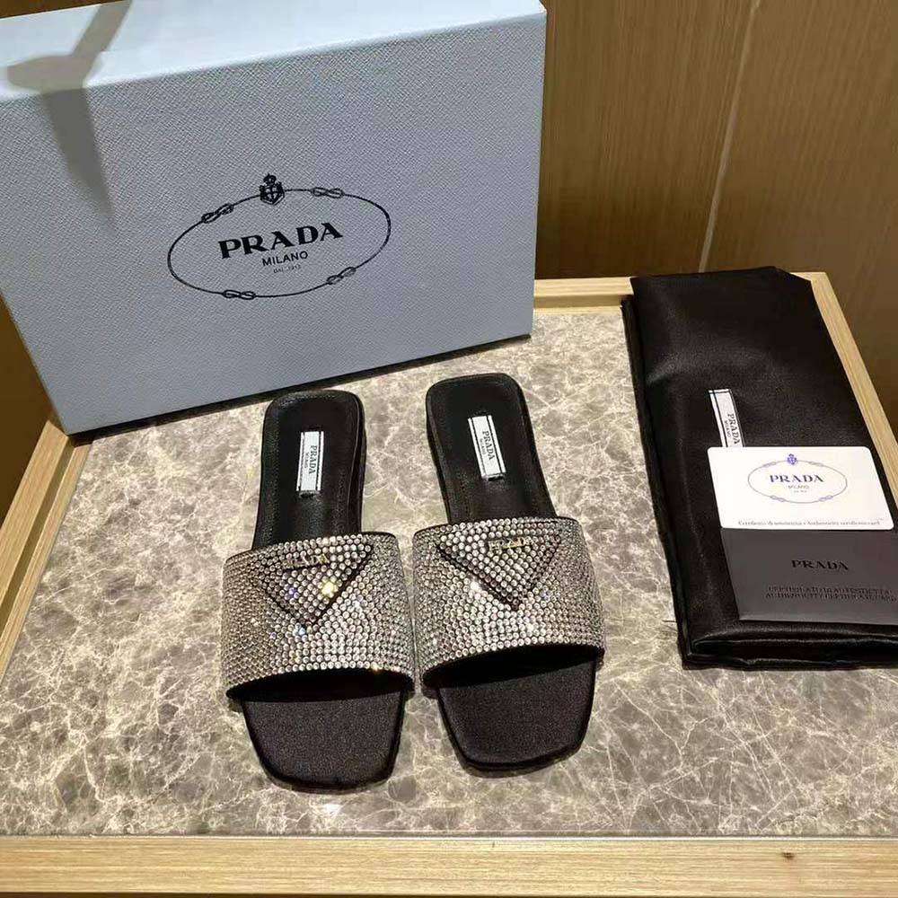 Close-up of crystal embellishments on Prada Women Satin Slides with Crystals-Black