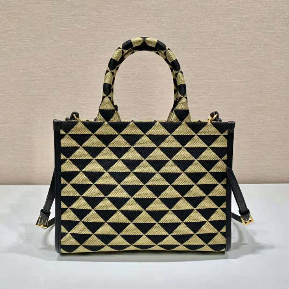 Side angle showing structured silhouette of Prada Women Small Prada Symbole Handbag-Brown