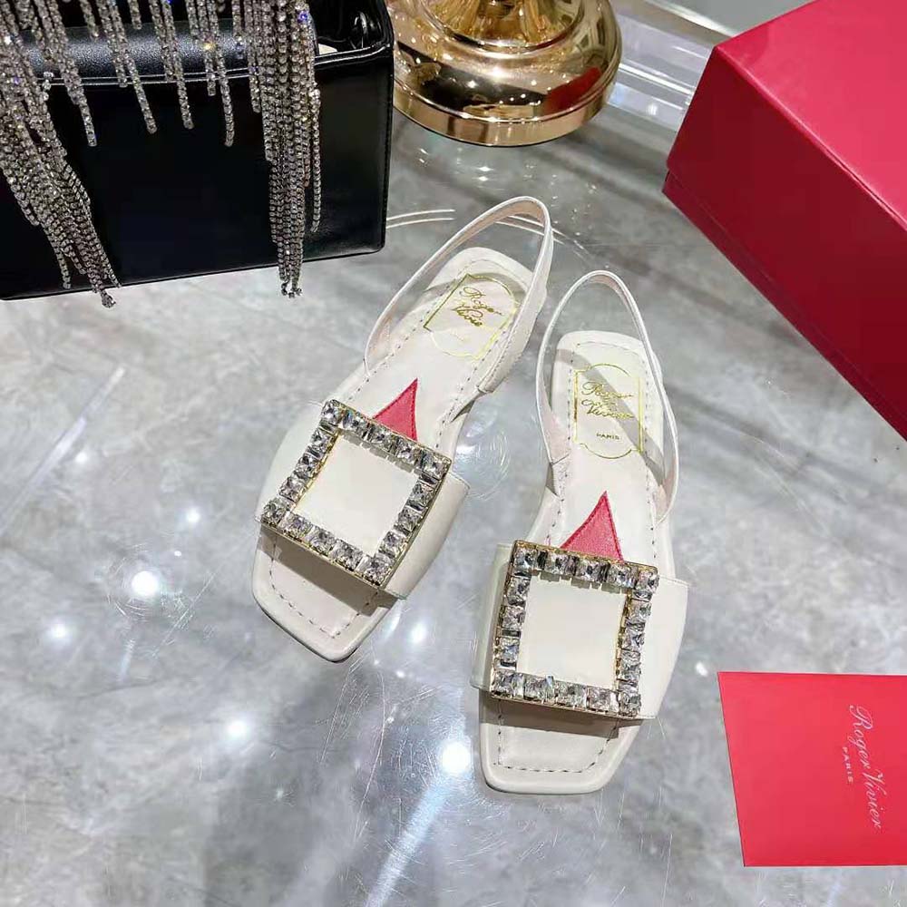 Close-up of sparkling Strass buckle on Roger Vivier Biki Love Sandals white leather