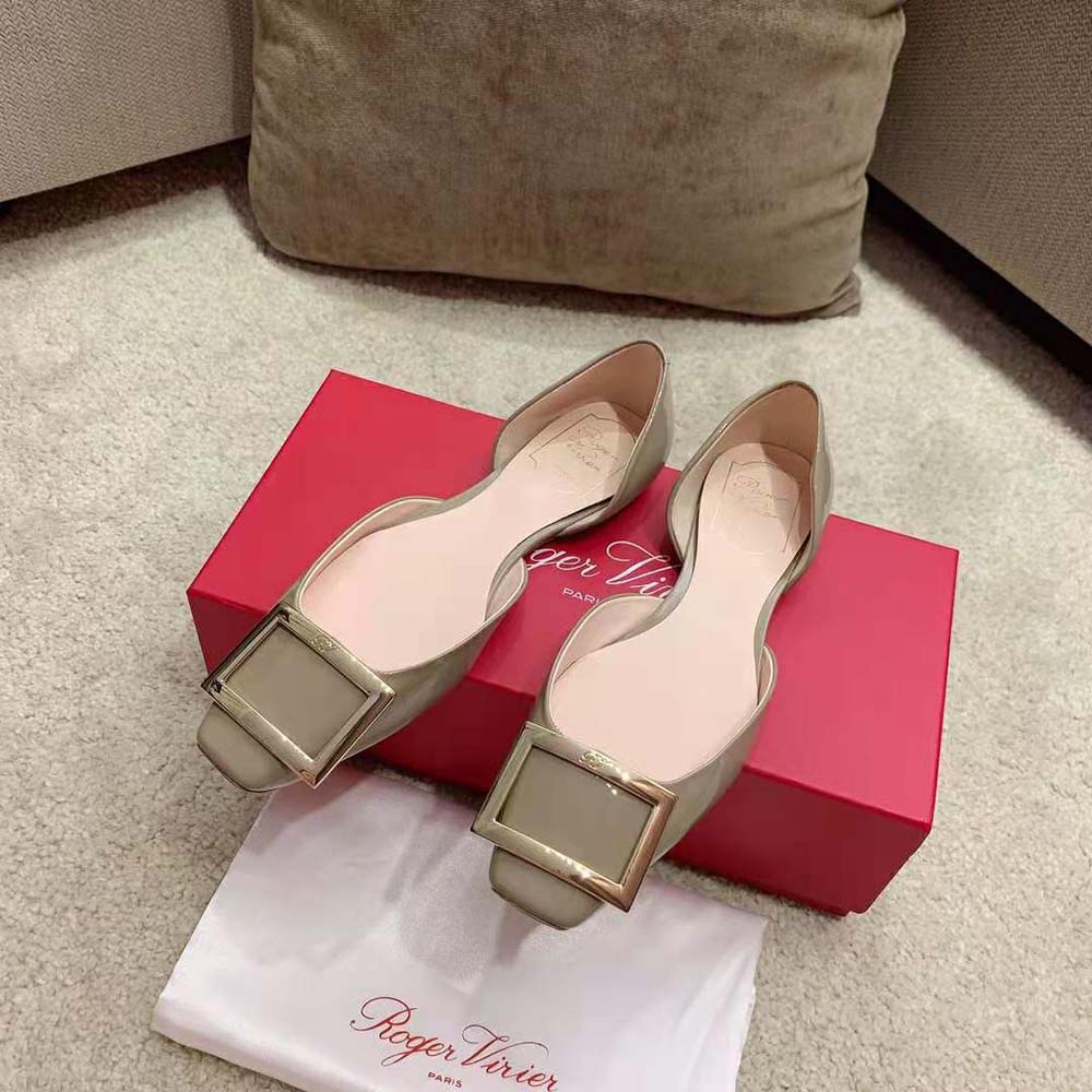 Overhead view showing beige patent leather and Dorsay cut of Roger Vivier ballerinas