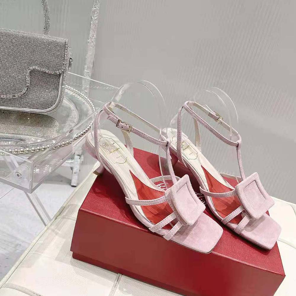 Close-up of pink leather and covered buckle on Roger Vivier sandals