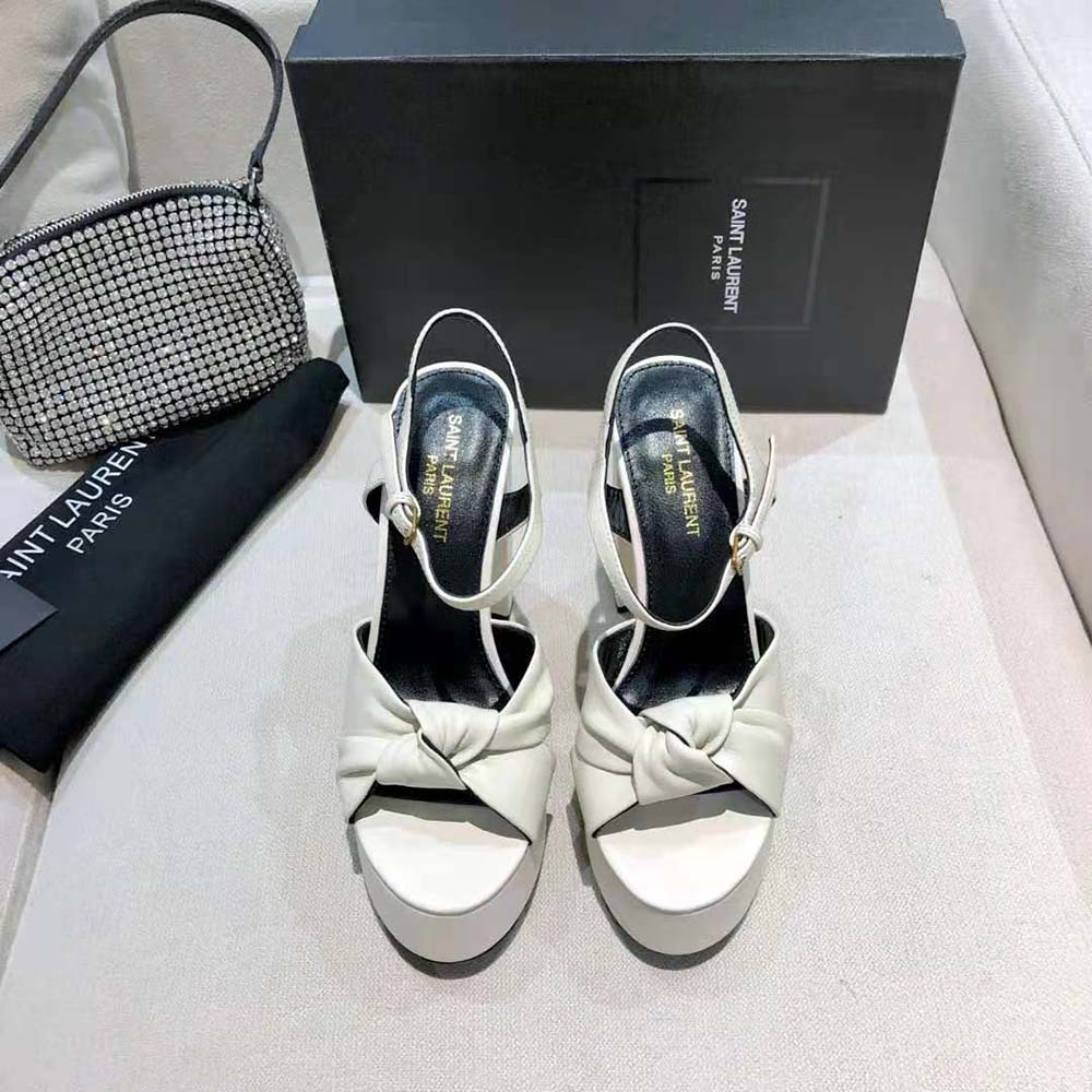Close-up of gold YSL hardware on Saint Laurent YSL Women Bianca Sandals