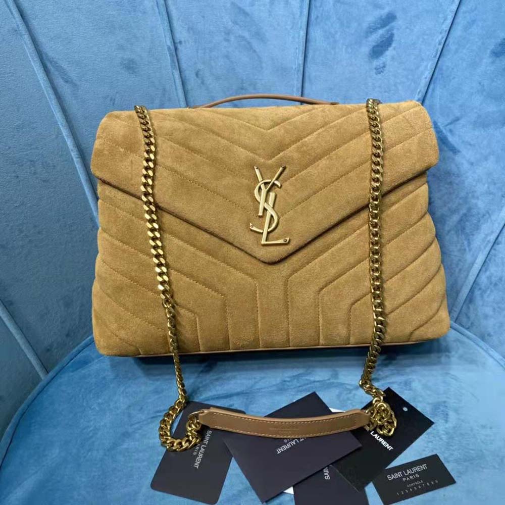 Side angle showing magnetic flap closure on Saint Laurent YSL Loulou bag