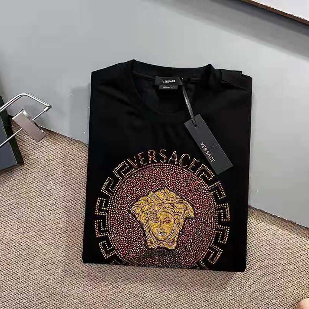 Close-up of gold Medusa embellishment on Versace Women Embellished Medusa T-shirt