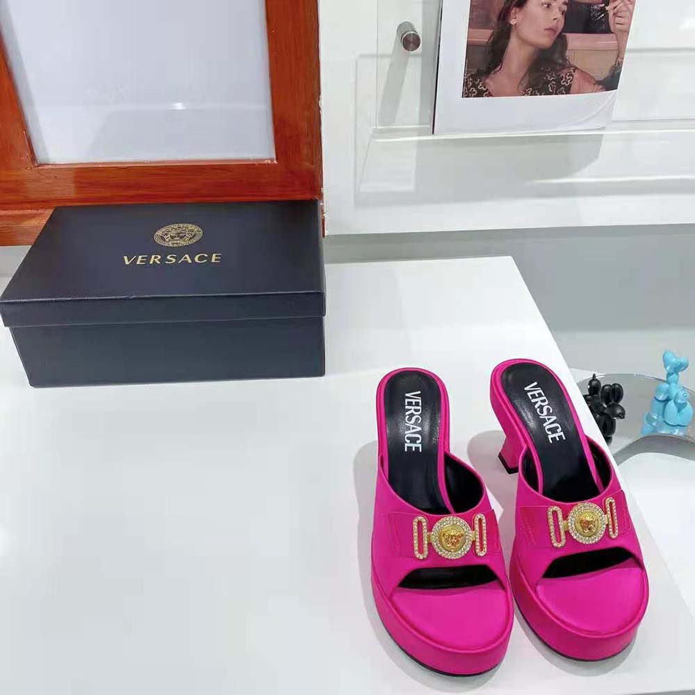 Close-up of gold Medusa hardware on Pink Versace Women Medusa Biggie Mules