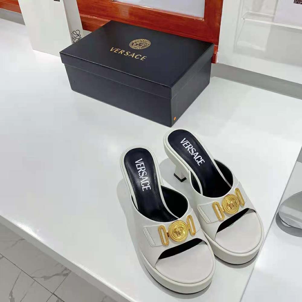 Side view of 85mm heel on Versace Women Medusa Biggie Mules white