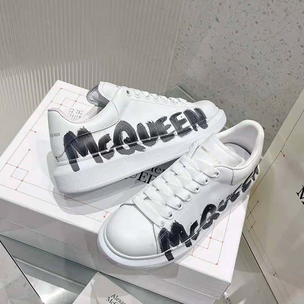 Overhead shot showing white leather and chunky sole of Alexander Mcqueen Graffiti Sneaker