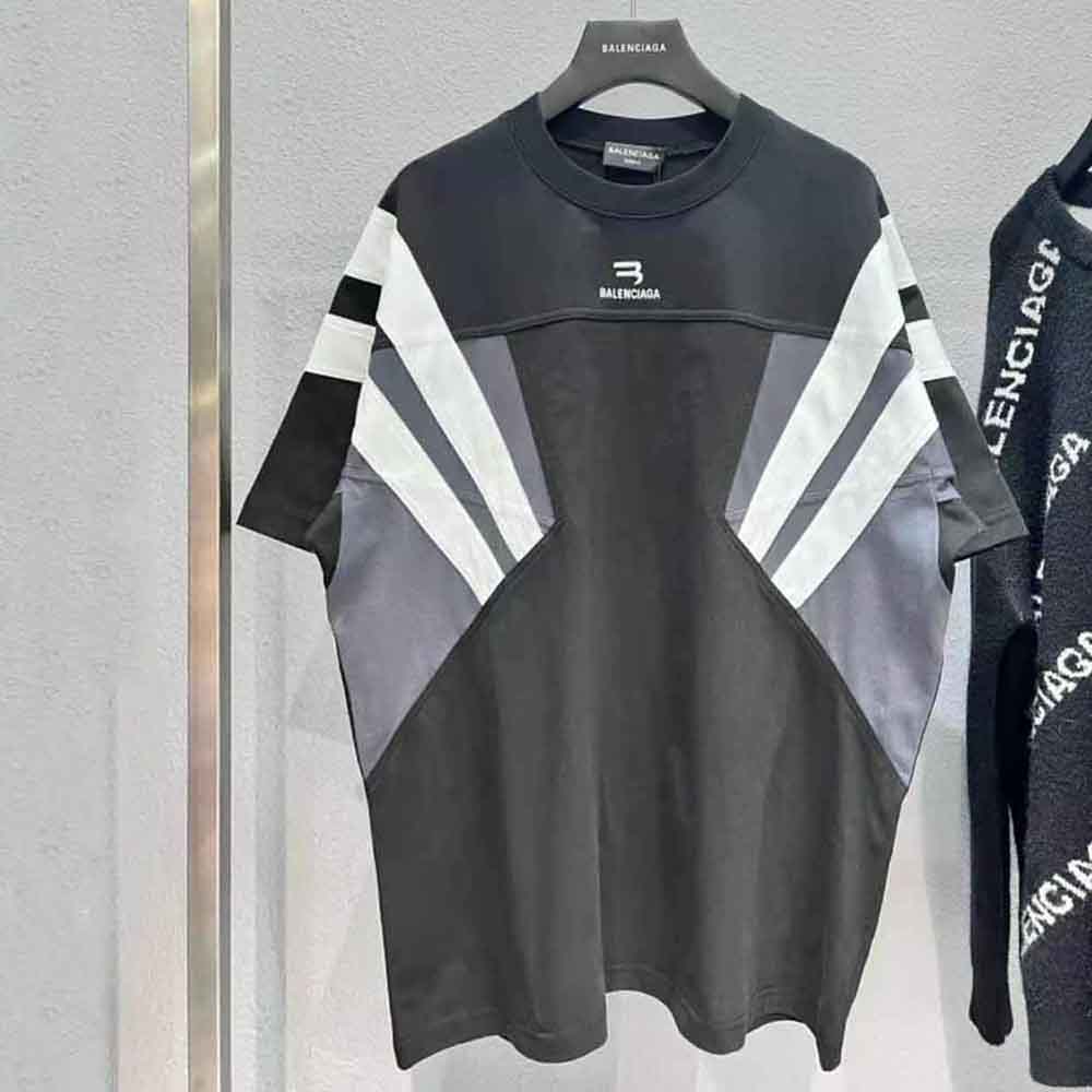 Close-up of signature B logo on black Balenciaga T-shirt