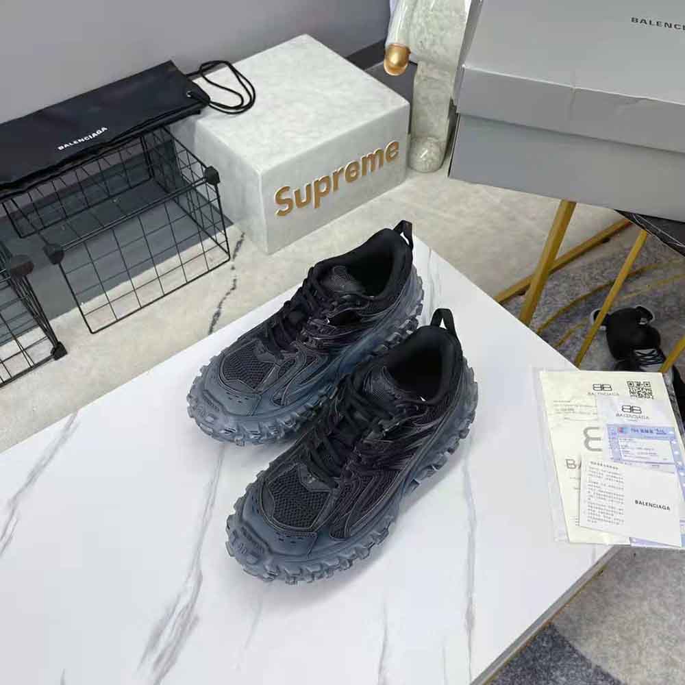 Top view showing lace-up closure and Balenciaga branding on Defender sneaker