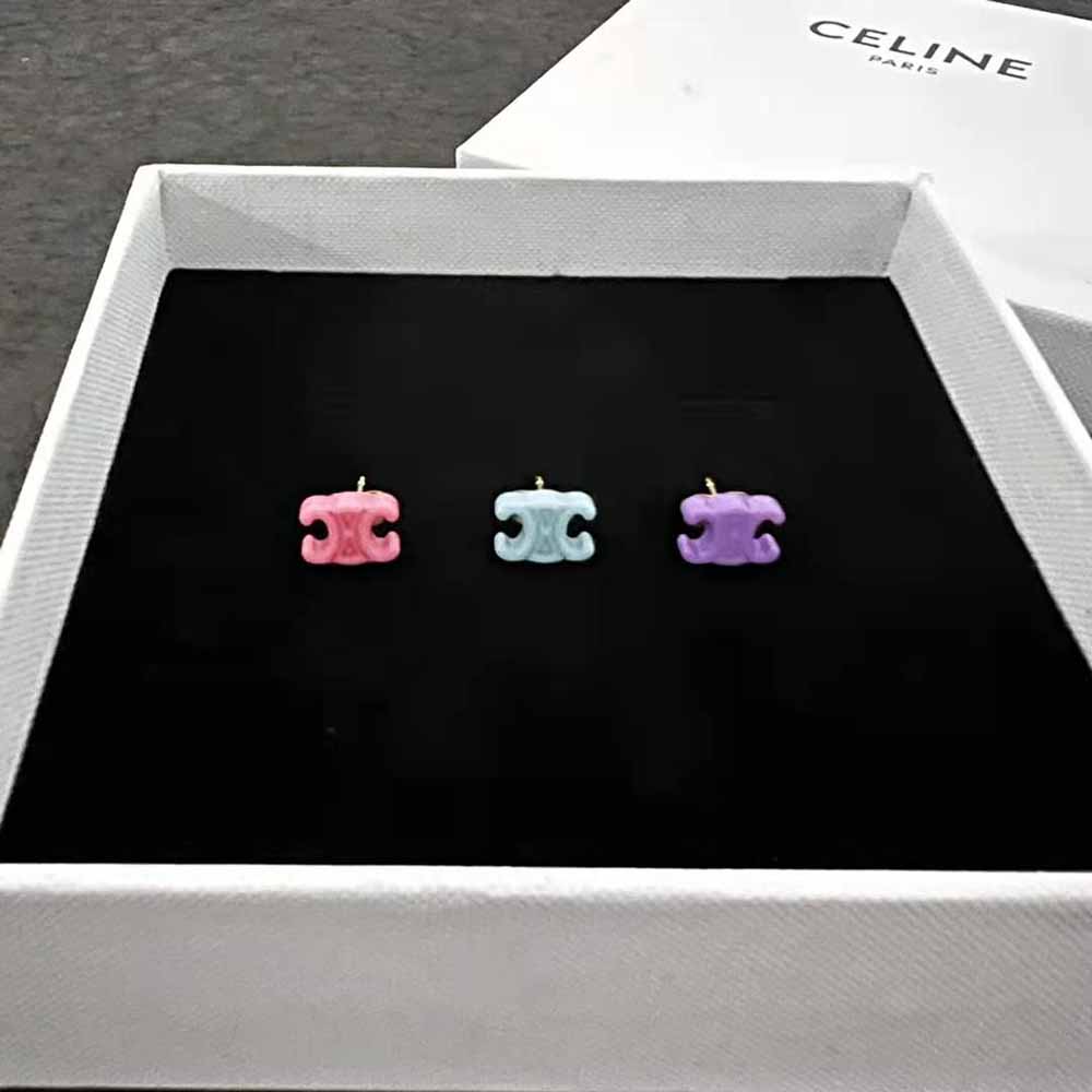 Side angle showing gold finish and brass base of Celine Women Baby Set of 3 Studs
