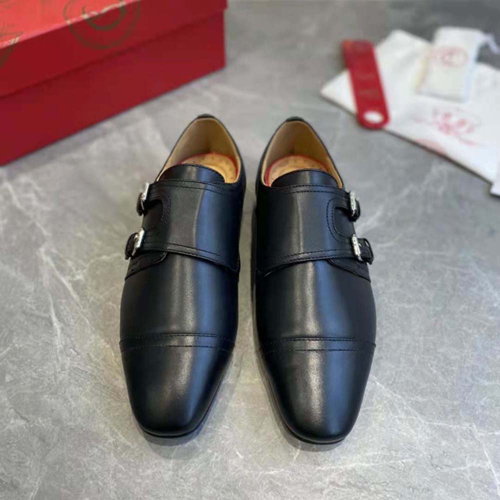 Close-up of black calf leather and signature red sole detail